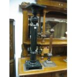 A Mahogany Plant Stand, ring turned and fluted column, stepped squared plinth, height 77cm, and an