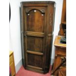 A XX Century Oak Hall Wardrobe, with a panelled door and reeded and panelled sides.