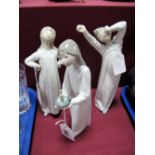 Three Lladro Figures of a Boy and Girls, in nightgowns.