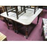 A XIX Century Mahogany Dining Table (Base), on ring turned tapering legs, later replaced oak top and