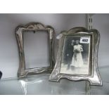 A Hallmarked Silver Mounted Photograph Frame, of shaped design on wooden easel back; together with