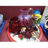 A XIX Century Cranberry Dimpled Water Jug, ruby nobbled vase, amethyst spill vase, glass clown.