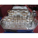 A Set of Six Clear Glass Wines, moulded foliate decoration and gilt rims; together with twelve