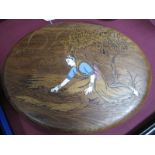 An Early XX Century Oval Indian Hardwood Panel, inset with ivory depicting a lady fetching water