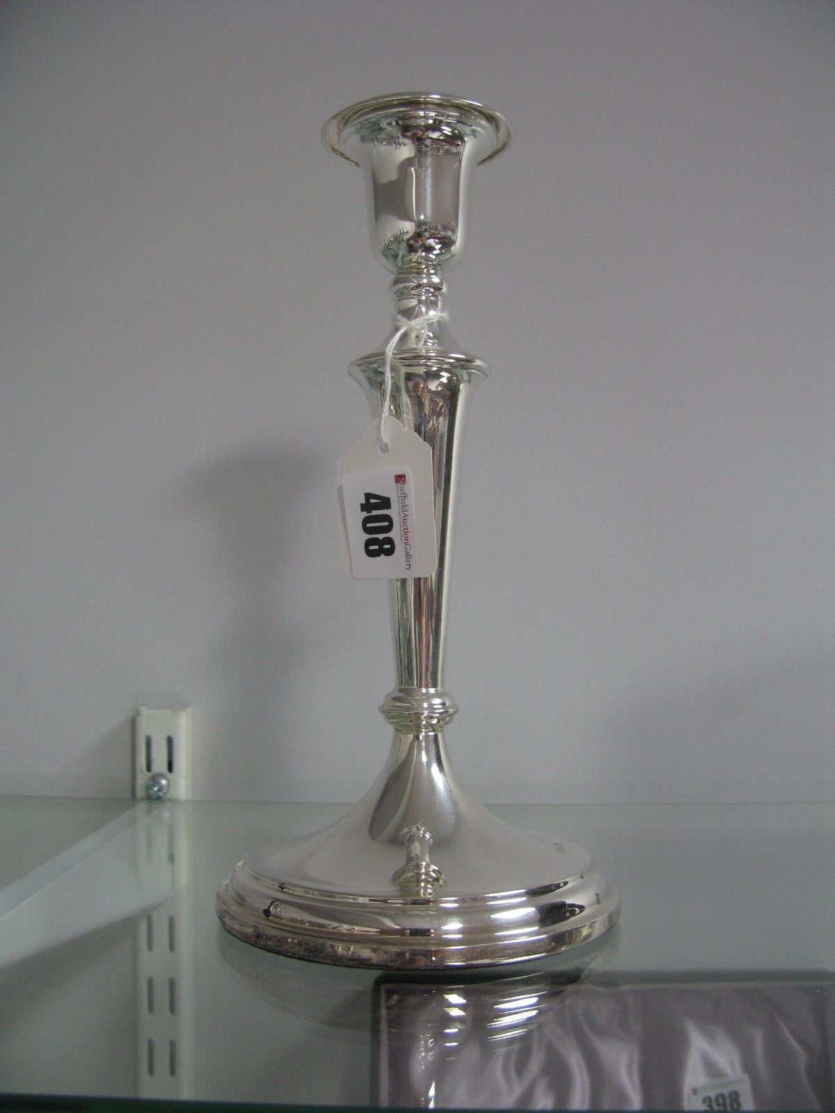 A Hallmarked Silver Candlestick, of plain tapering design, with removable nozzle, 25cm high (base