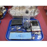 Decanter, cutlery, silver spoon, sugar tongs, glass oil lamp, duck trinket, etc:- One Tray