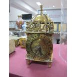 A Smiths Brass Eight Day XVII Century Style Lantern Clock, bell with finial over a circular dial,