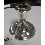 A Hallmarked Silver Dwarf Candlestick, of plain tapering design, 9.5cm high (base weighted).