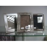 Two Hallmarked Silver Mounted Photograph Frames, each on brown plastic easel back, overall height