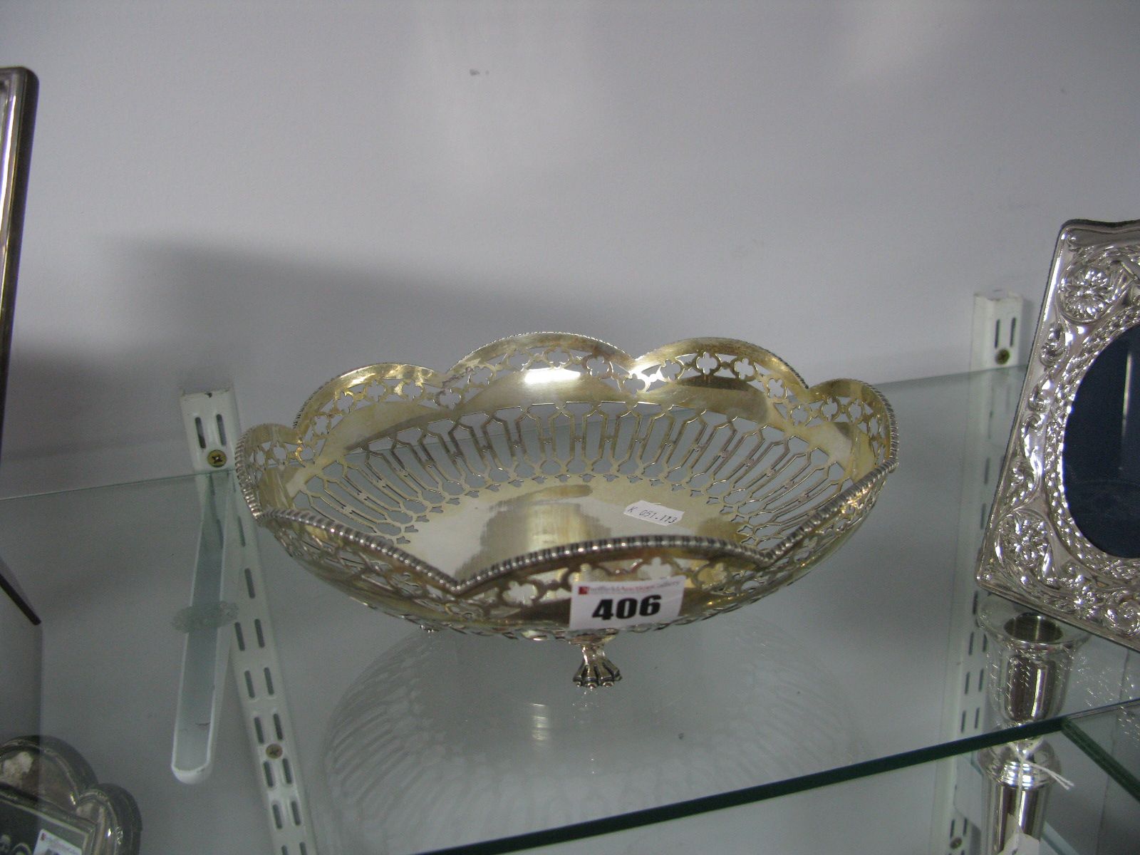 A Decorative Hallmarked Silver Dish, of geometric pierced design, with gadrooned edge, raised on