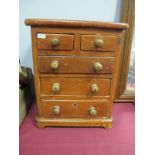 A Victorian Stained Pine "Apprentice Piece" Miniature Chest of Drawers, two short over three
