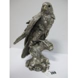 A Hallmarked Silver Filled Model of a Bird of Prey, naturalistically detailed, overall height 22.