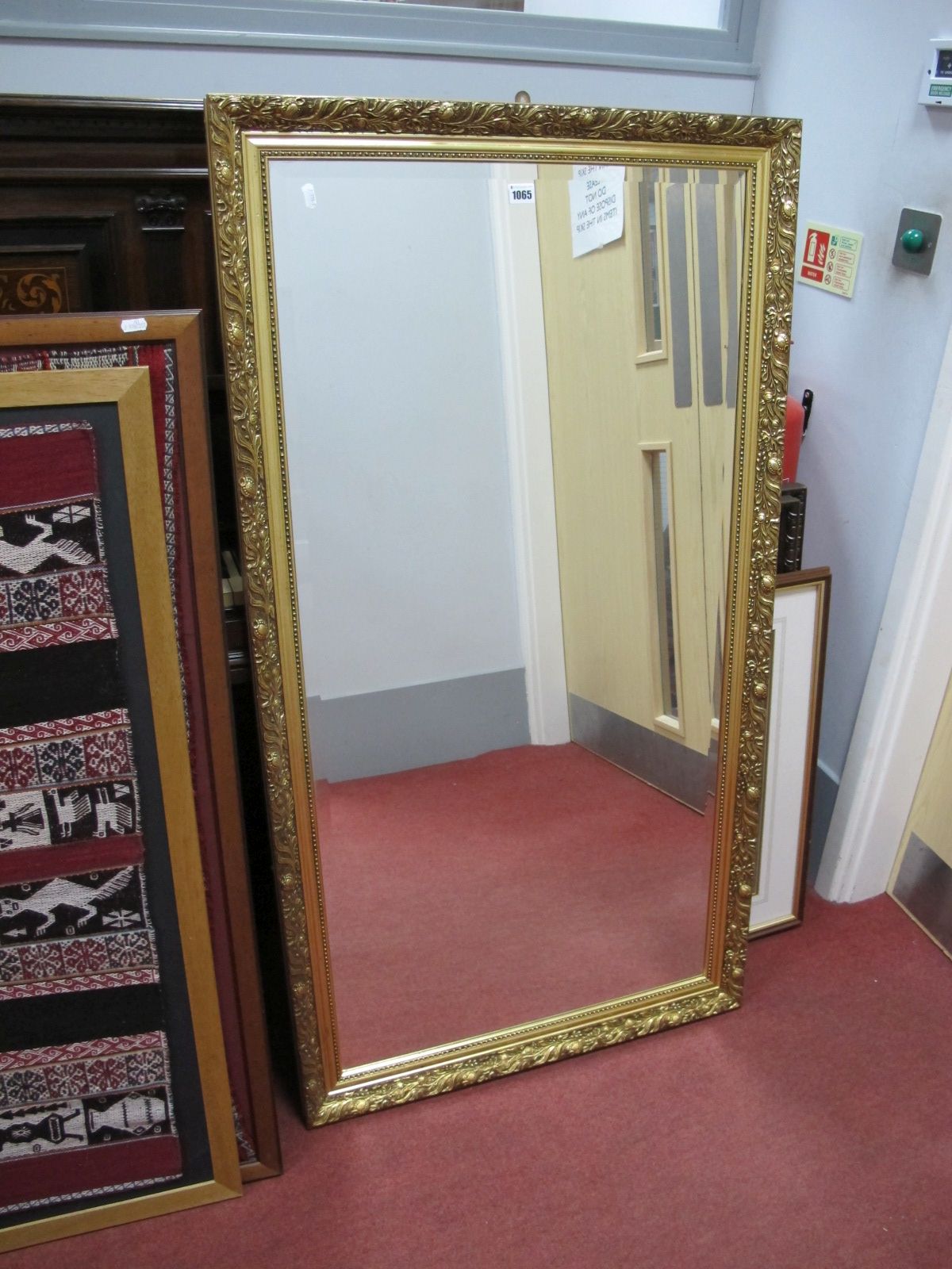 A Late XX Century Continental Wall Mirror, in a Rococo style scrolled gilt frame, moulded with shell