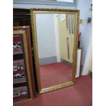 A Late XX Century Continental Wall Mirror, in a Rococo style scrolled gilt frame, moulded with shell