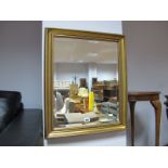 A Rectangular Bevelled Wall Mirror, in gilt frame, another smaller and oval example. (3)