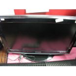 A Panasonic Viera Flatscreen Television, with a three tier clear glass television stand. (2)