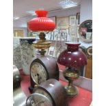 A Circa 1900 Brass Paraffin Lamp, solid reservoir above Corinthian column, all under a ribbed red