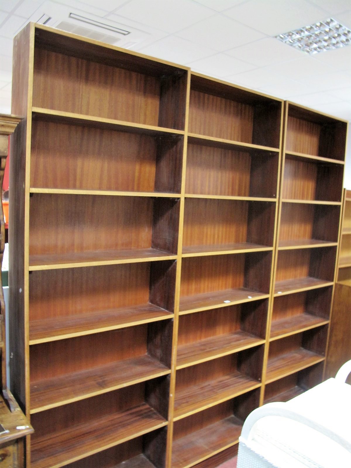 Three Large Teak Freestanding Bookcases, approximately 226cm high.