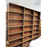 Three Large Teak Freestanding Bookcases, approximately 226cm high.