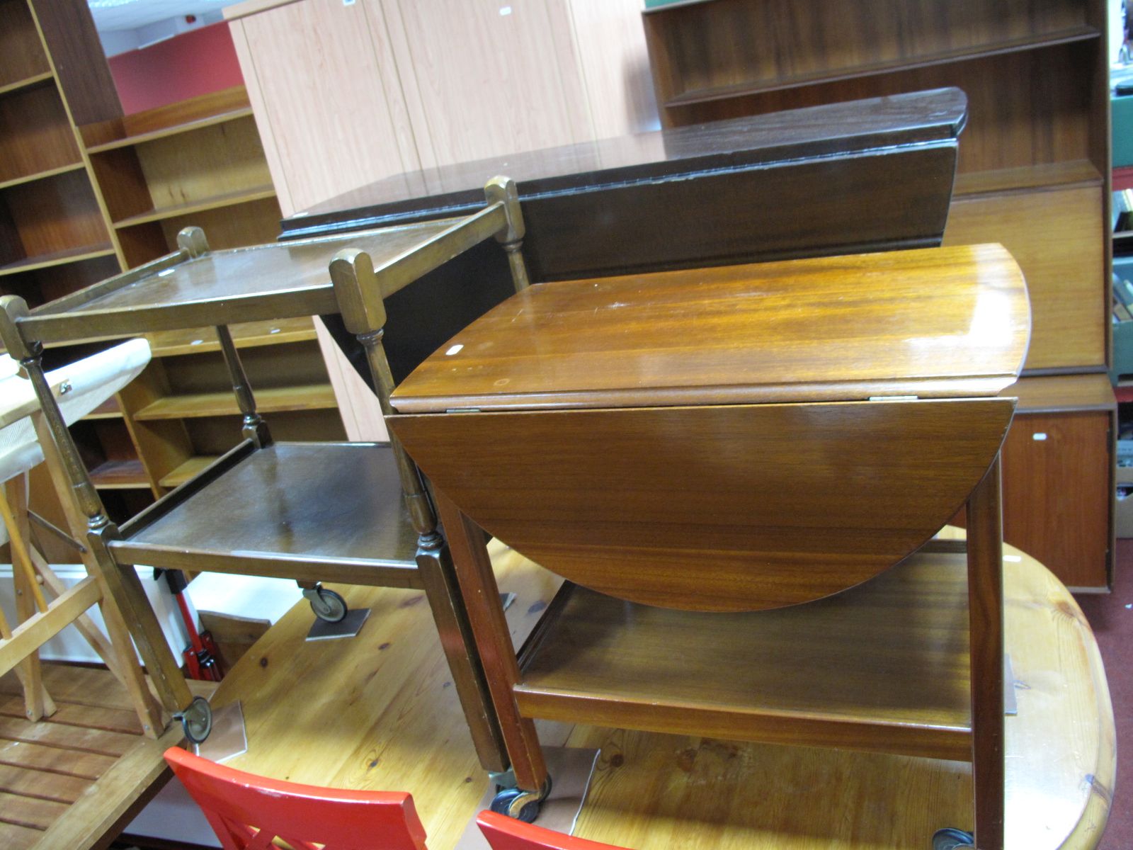 A C.W.S Oak Two Heights Tea Trolley, a mahogany tea trolley and a drop leaf dining table. (3)