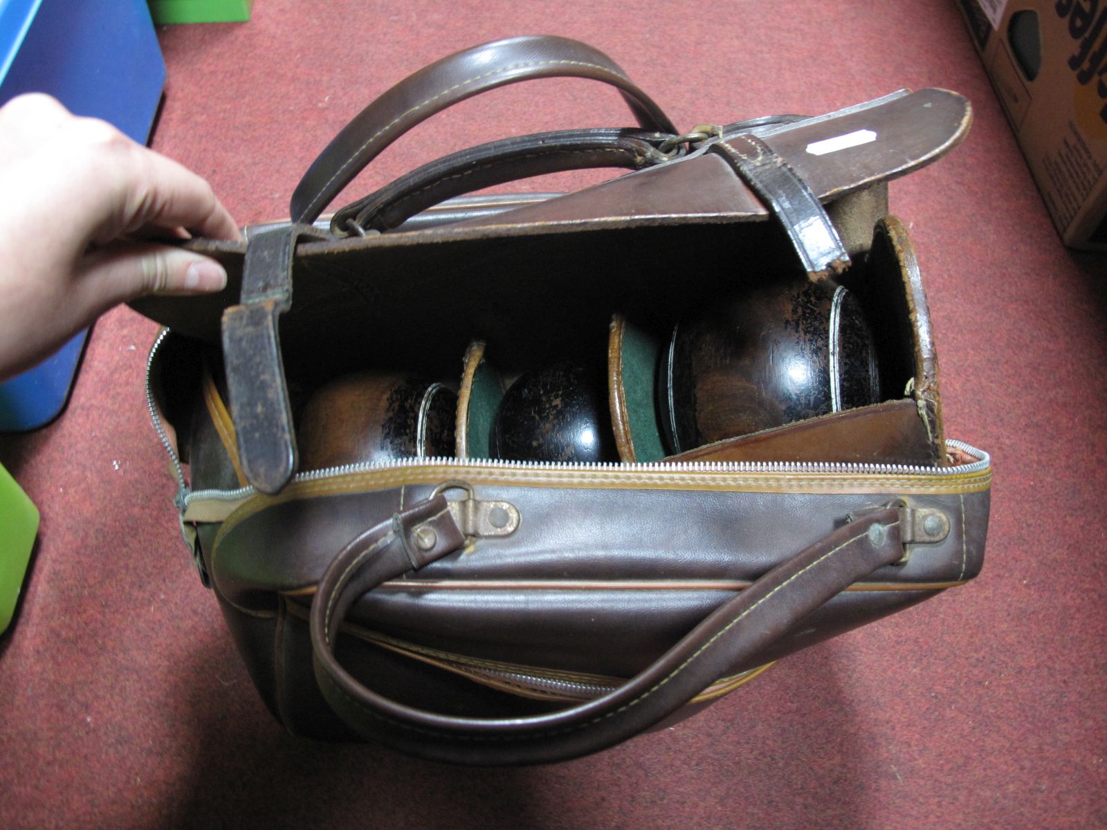 Two Lignum Vitae Crown Green Bowls and Jack, in fitted leather case; plus two Taylor Elite 2-6