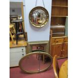 An Early XX Century Rectangular Bevelled Wall Mirror, in a gilt cushioned frame with foliate