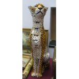 A Large Glazed Pottery Model of a Seated Cheetah, (ex John Lewis), height 85.5cm.