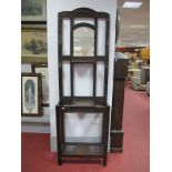 A Circa 1920's Oak Hall Stand, with central arched bevelled mirror, glove box and twin drip pans. (
