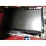 A Logik Wall Mounted 19" Flatscreen TV, (with black bracket, loose TV stand and remote), a Philips