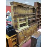 A Pine Dresser, with stepped pediment, two shelves, five spice drawers, the base with four small