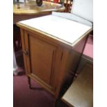 An Early XX Century Light Oak Pot Cupboard, with low back on turned legs.