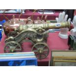 A Heavy Cast Brass Model Canon, with flanking dragon cast supports, length 45cm.