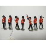 A Set of Seven Britains Mid XX Century Lead Figures, six Pioneers in Busby's with axes and a