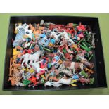 A Quantity of Plastic Farm Figures and Animals by Britains, Herald, Charbens and Others, playworn.
