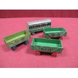 Three Pre-War Dinky Railway Wagons, plus a Southern Coach. No obvious fatigue but playworn.