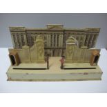 A Tinplate Clockwork Model of Buckingham Palace, with two guards matching in front of palace,