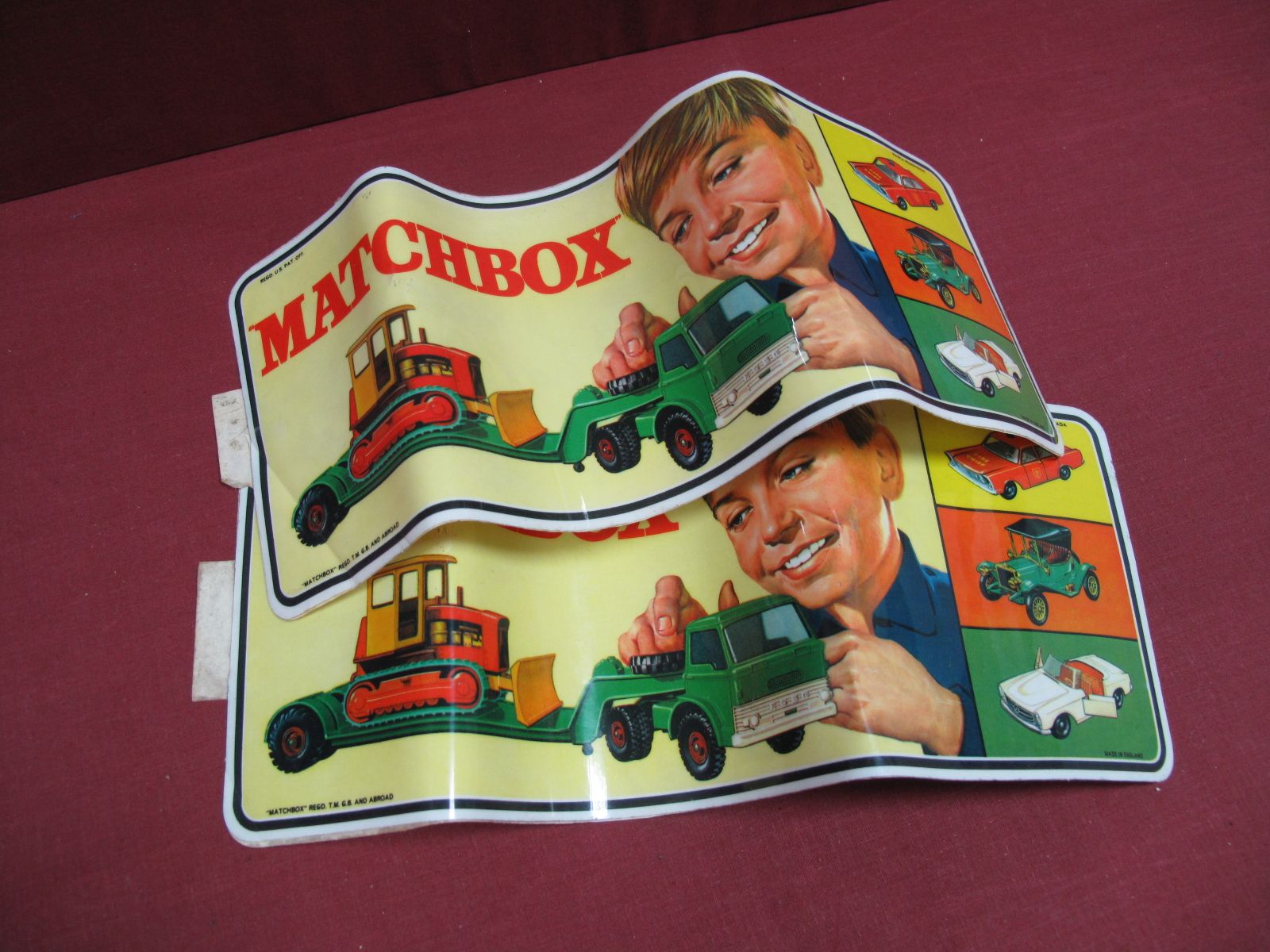 Two 1970 Original Matchbox Dealer Stickers, showing a boy with kingsize low loader, a Yesteryear and