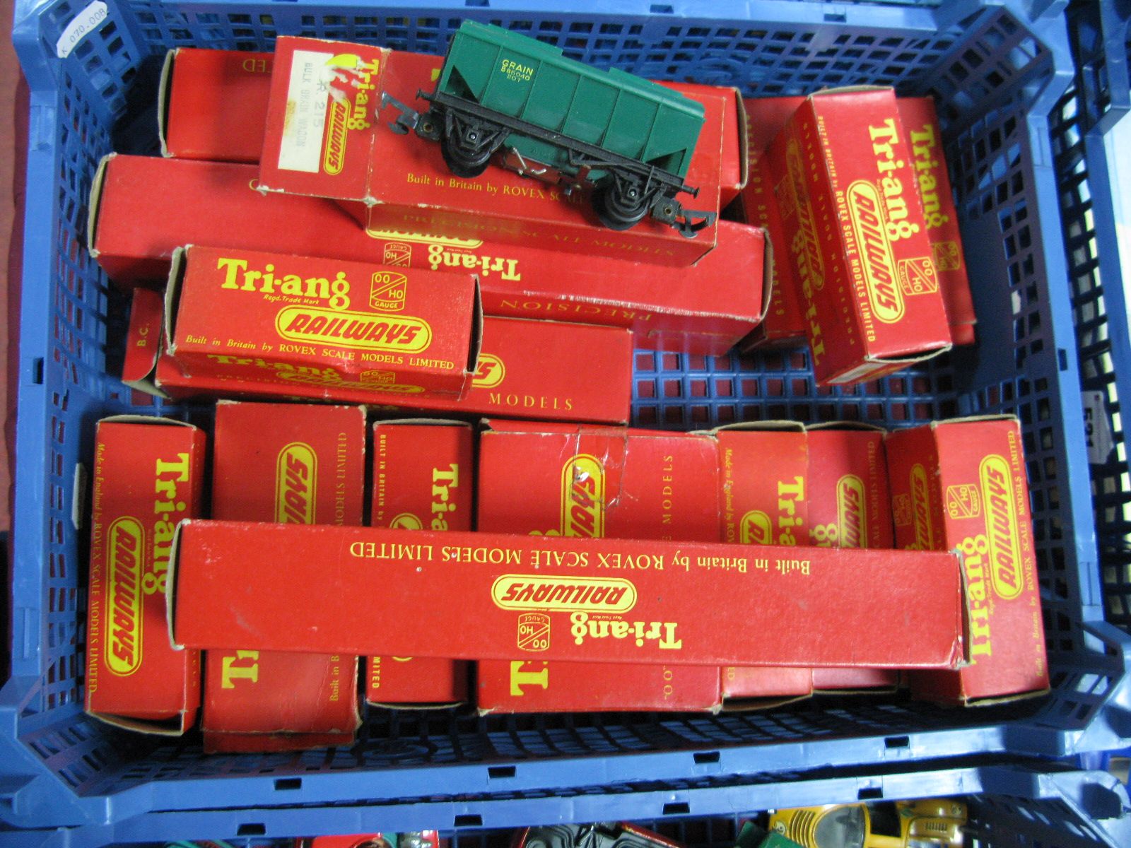 A Quantity of 'OO' Gauge Model Railway Four Wheel Wagons and Coaches by Tri-ang, all playworn and