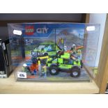 A Lego City shop Display No. 60121, in perspex case.