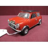 A 1/25 Scale Mini-Cooper by Palitoys, black/red, appears unbroken, minor chipping to raised edges.