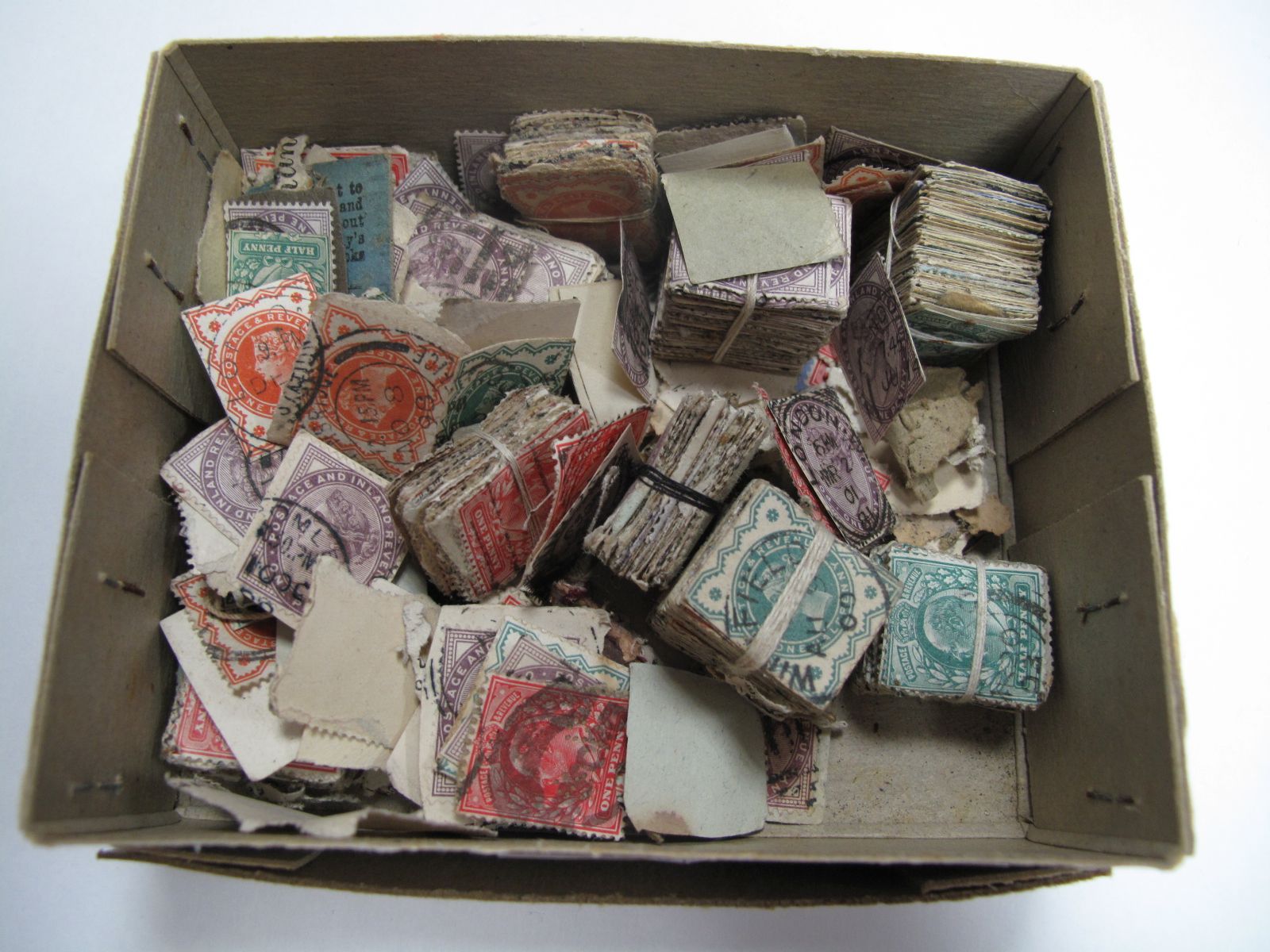 A Collection of Vintage Stamps, regularly pre-1911 and usually bundled by type.