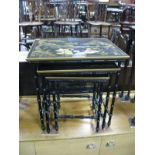 A Modern Black Lacquered Nest of Tables, relief decoration of figures in a landscape, gilt