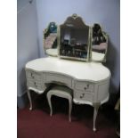 A Mid XX Century French Style Kidney Shaped Dressing Table, in cream with arched triple mirrors over