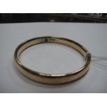 A 9ct Gold Bangle, of plain design.