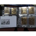 A Danbury Mint "22kt Gold World Wrestling Entertainment Cards" Album, with contents.
