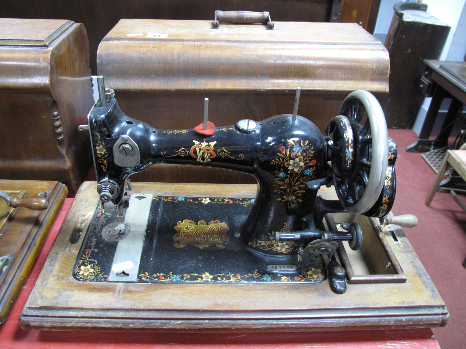 An Early XX Century CWS "Federation Family Machine" Sewing Machine, numbered 310094, in walnut case.