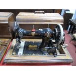 An Early XX Century CWS "Federation Family Machine" Sewing Machine, numbered 310094, in walnut case.