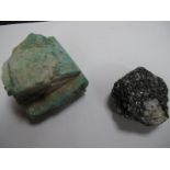 A Green Mineral Specimen, 7.5cms long; together with another specimen, 6.5cms long. (2)