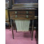 An Early XIX Century Regency Mahogany Work Table, with crossbanded top, two small drawers over