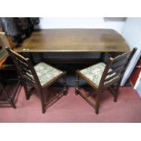 An Ercol Style Refectory Dining Table, and two associated ladder back chairs.